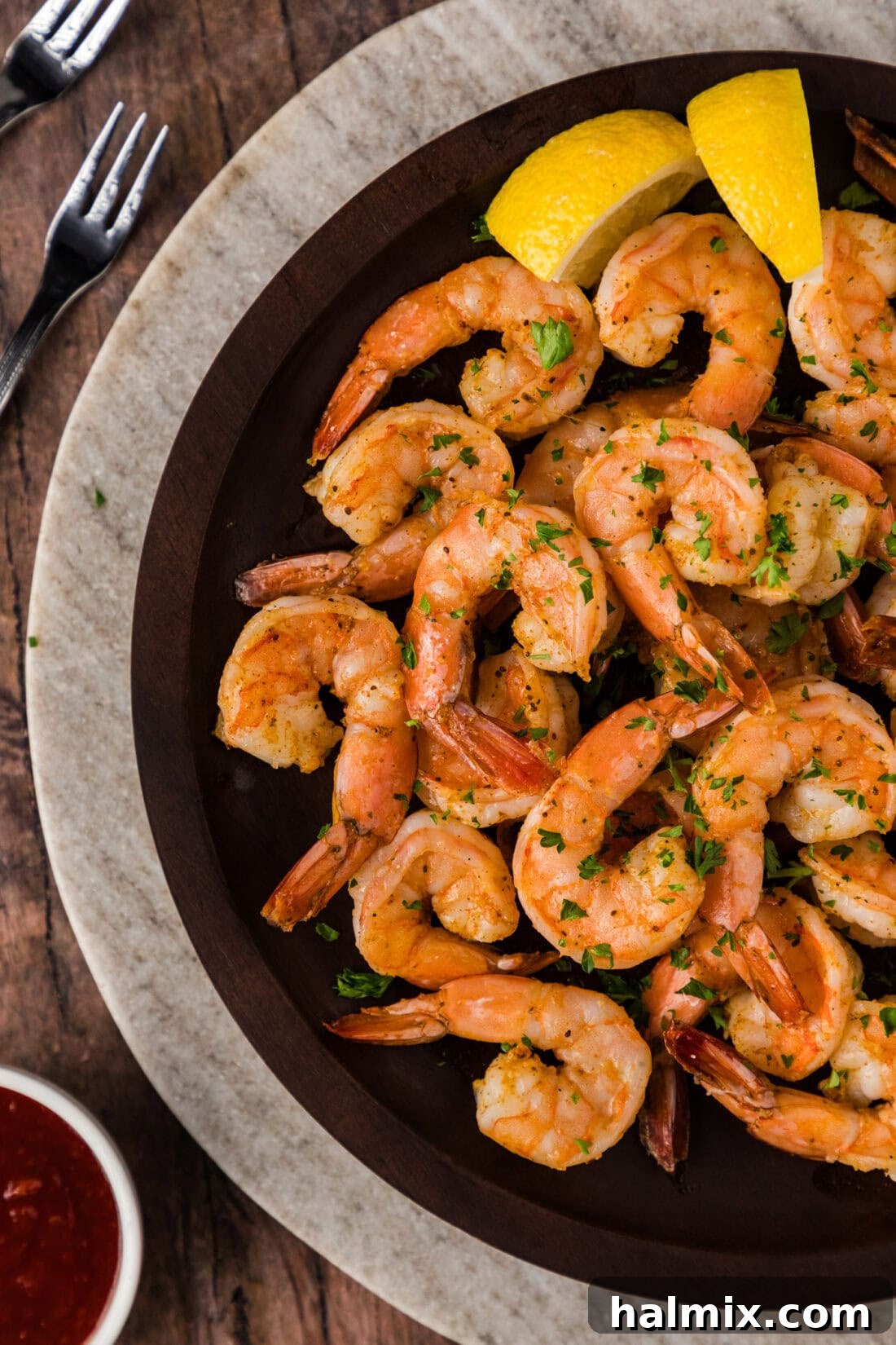 Close up photo of perfectly cooked Steamed Shrimp on a white plate, ready to be served.