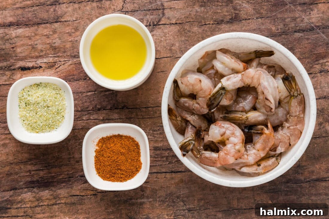 Fresh ingredients laid out for Steamed Shrimp preparation, including shrimp, olive oil, and seasonings.