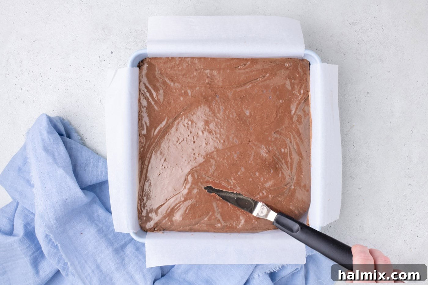 Creamy Cloud Bites 8 Whipped chocolate mixture spread evenly into the prepared square baking pan.