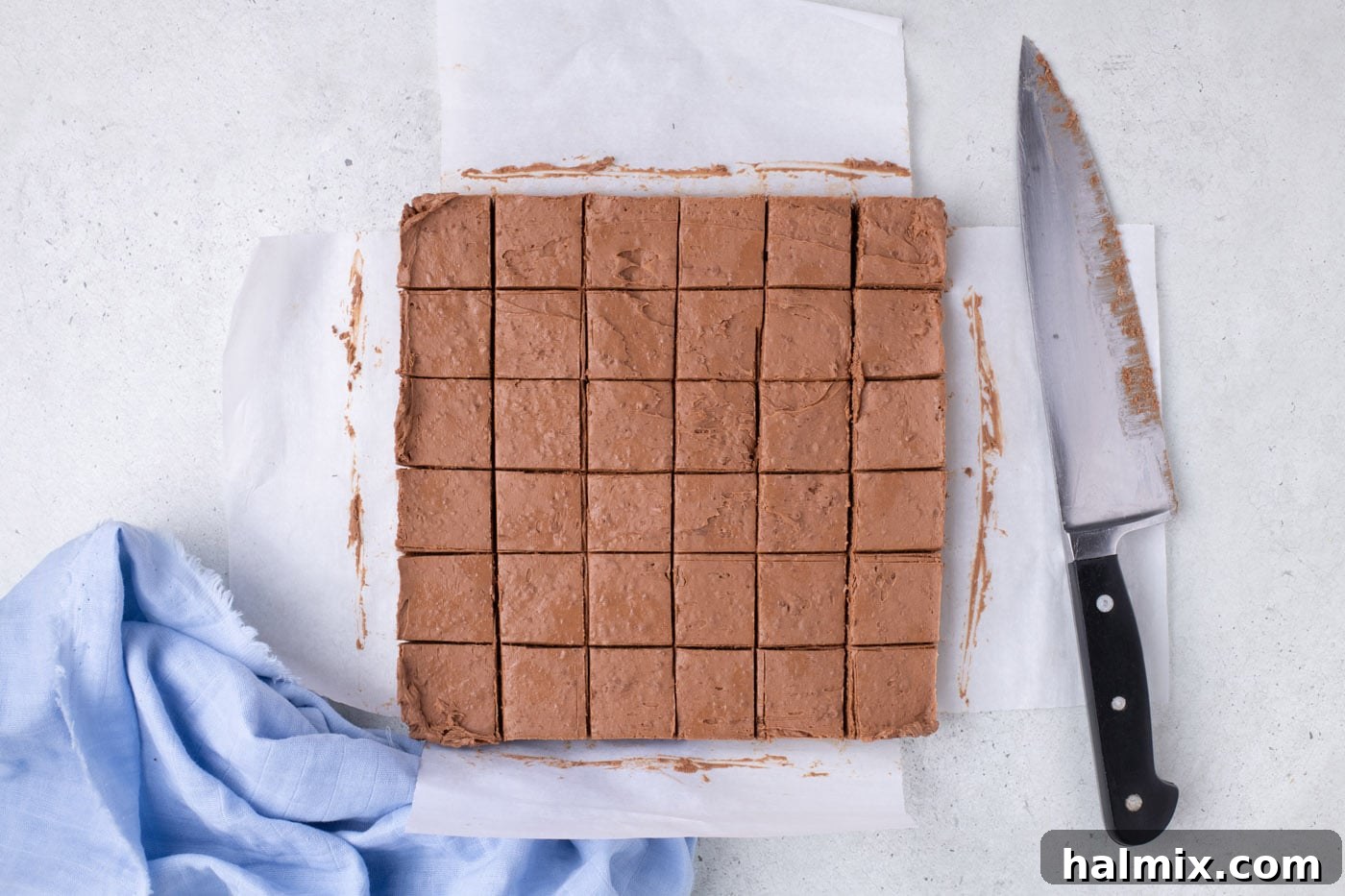 Creamy Cloud Bites 10 Whipped chocolate mixture sliced into uniform squares within the baking pan.