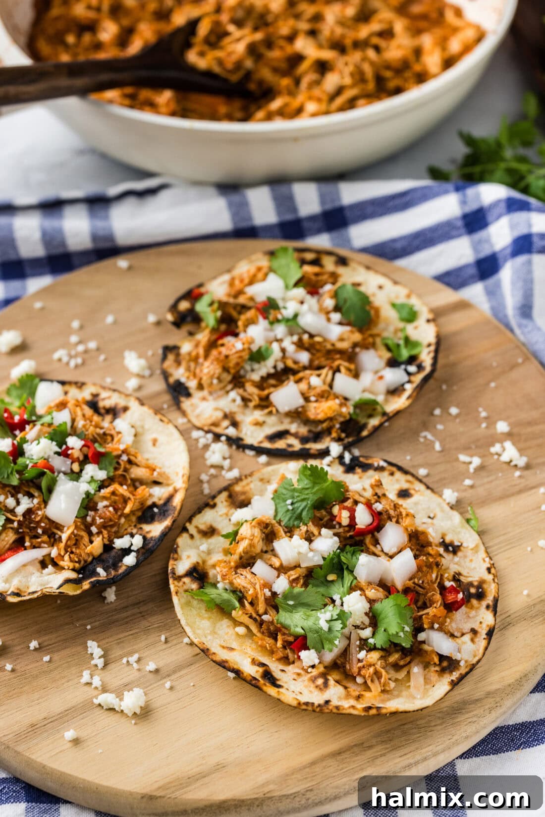Smoky Chipotle Chicken Tinga 2 Three tortillas of Chicken Tinga topped with cilantro, onions and cheese