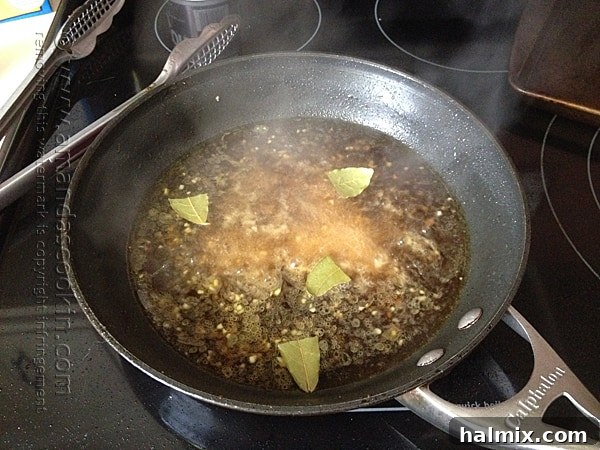 Deglazing a hot skillet with liquids, scraping up all the flavorful browned bits.