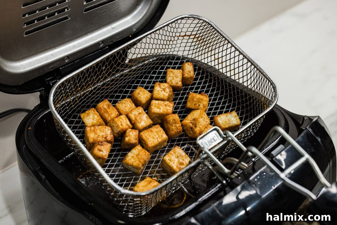 deep fried tofu in fryer basket