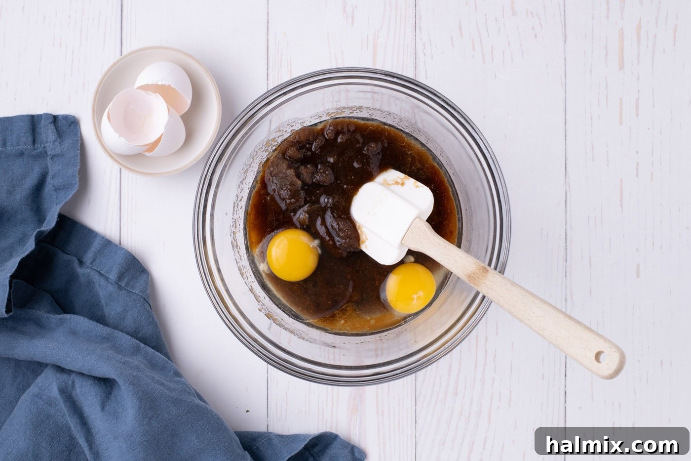 adding eggs to browned butter and sugar mixture