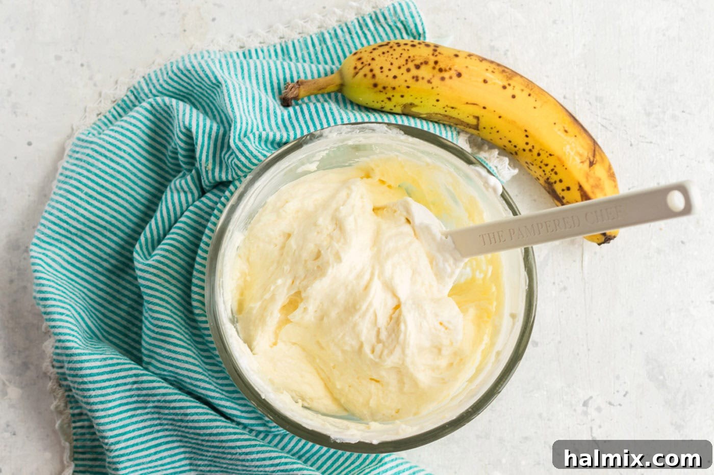 The finished banana-flavored whipped cream frosting, smooth and ready to be spread onto the cooled cake.