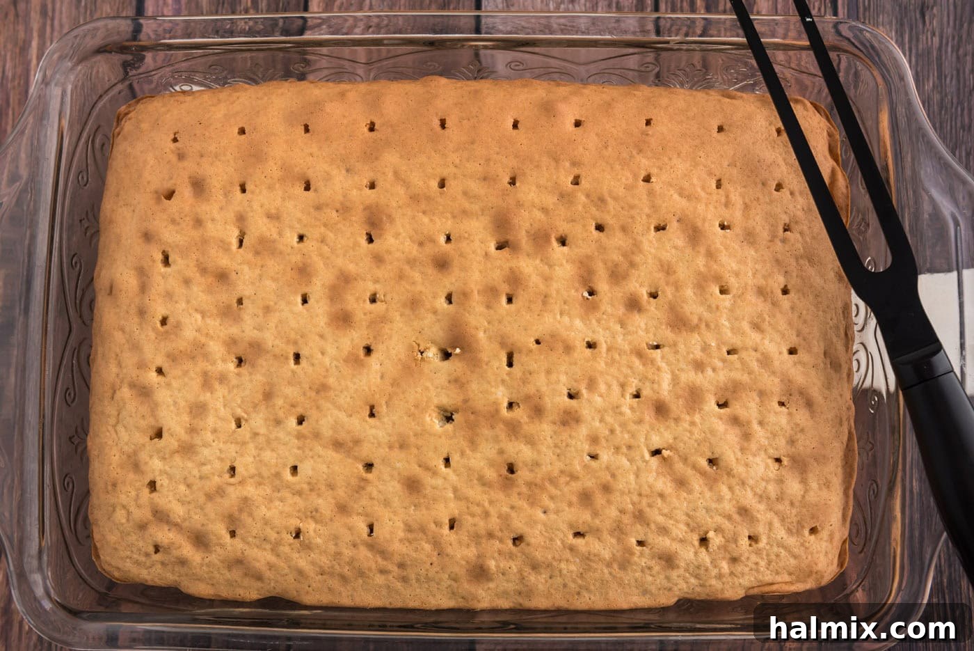 holes poked into baked cake