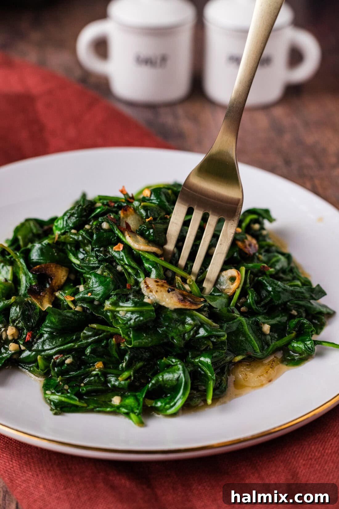 Fork in a pile of Stir Fried Spinach