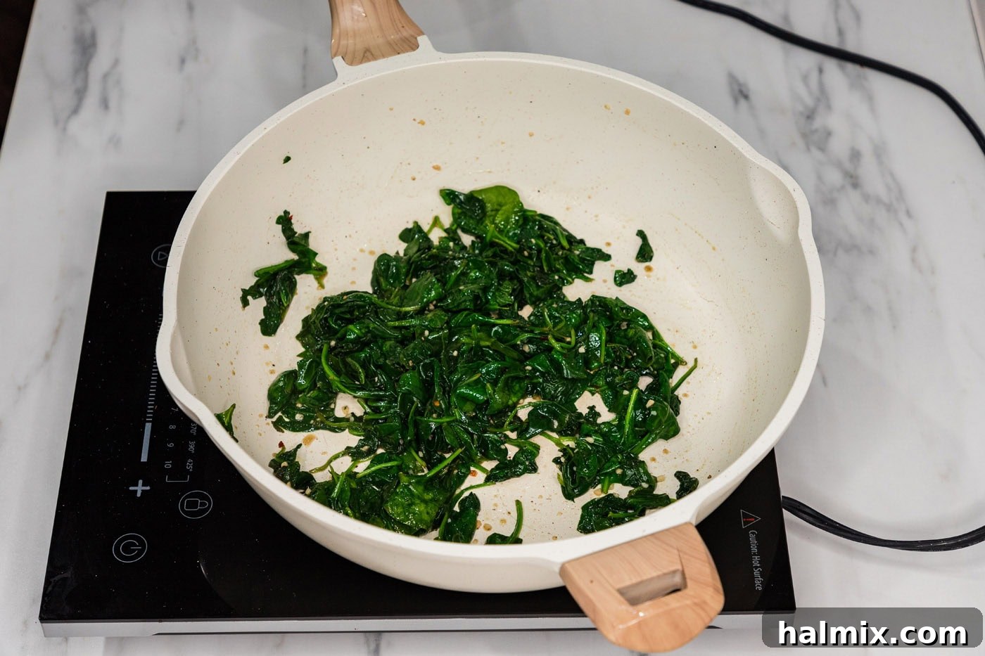 wilted spinach in a skillet