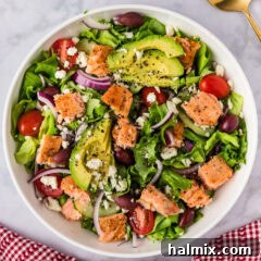 Close up photo of a bowl of Salmon Salad, highlighting the fresh ingredients