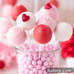 Valentine Cake Pops resting in a glass container