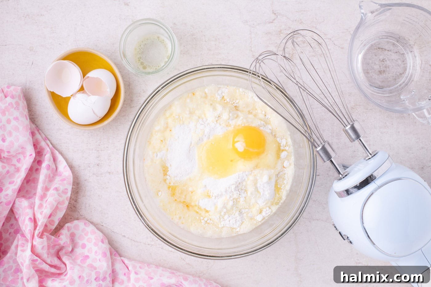 cake mix with butter, eggs, and water in a bowl