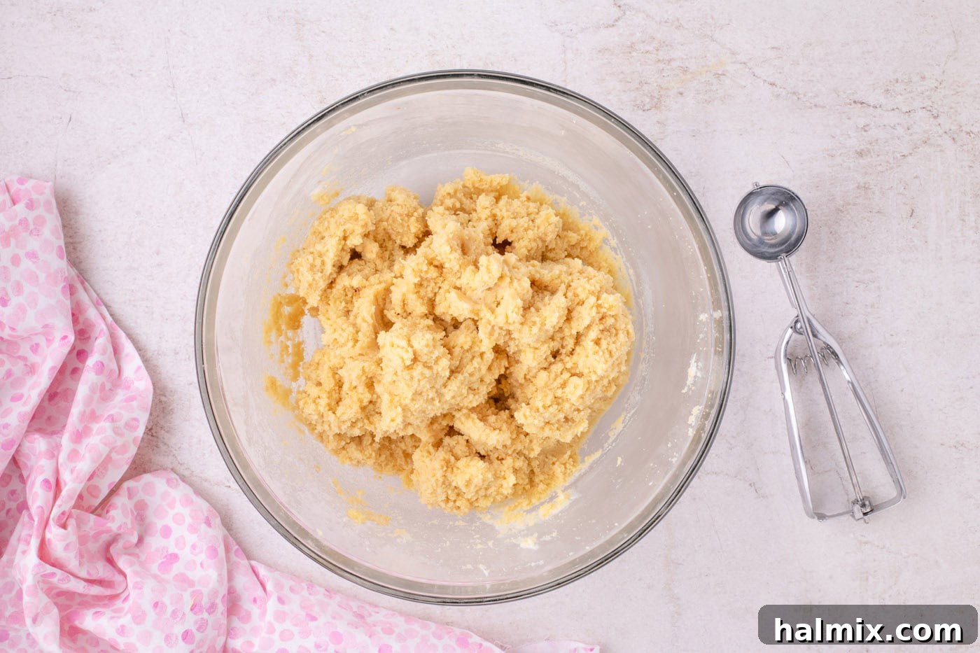 crumbled cake with frosting in a bowl