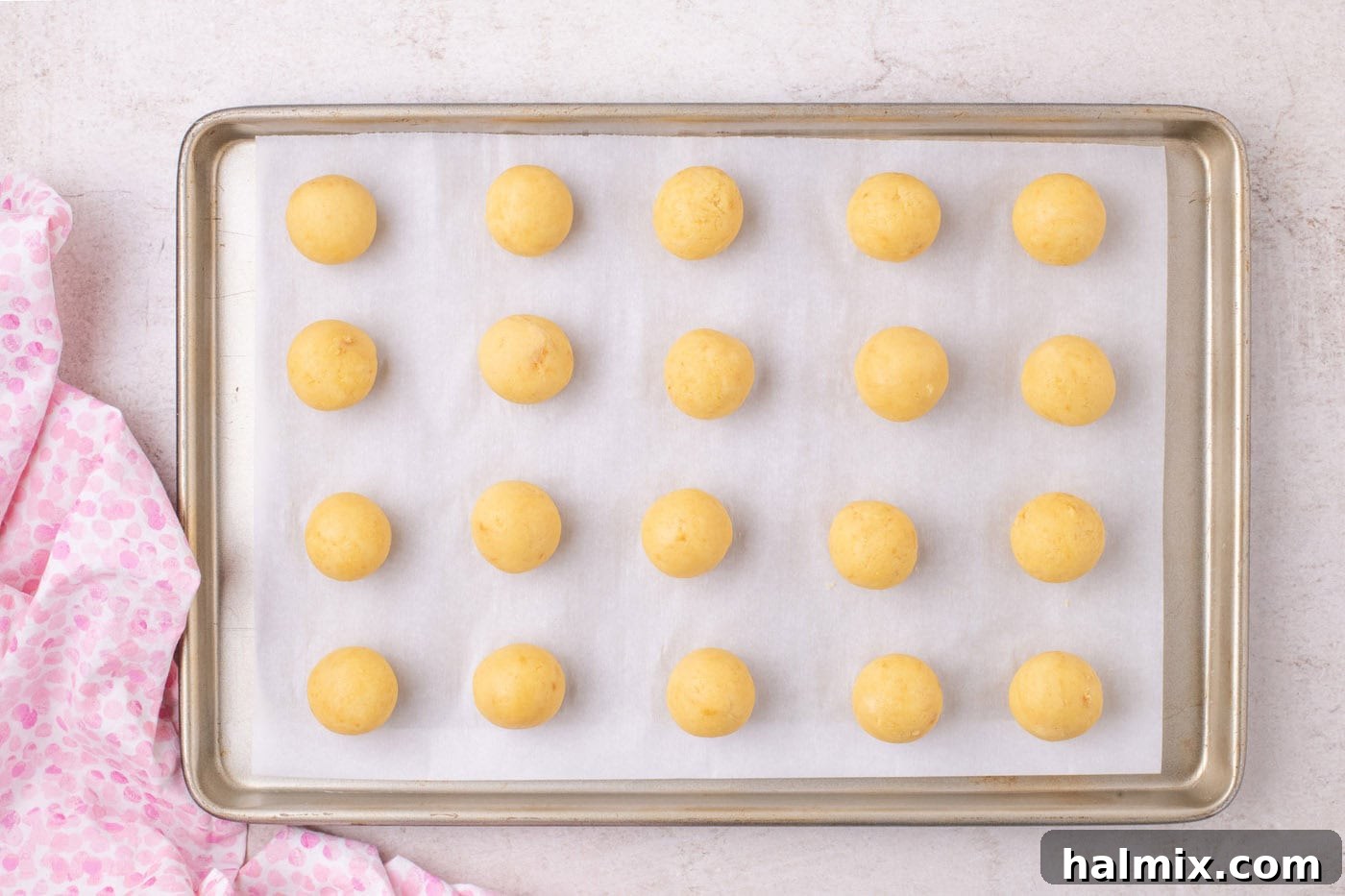 rolled cake balls on a baking sheet