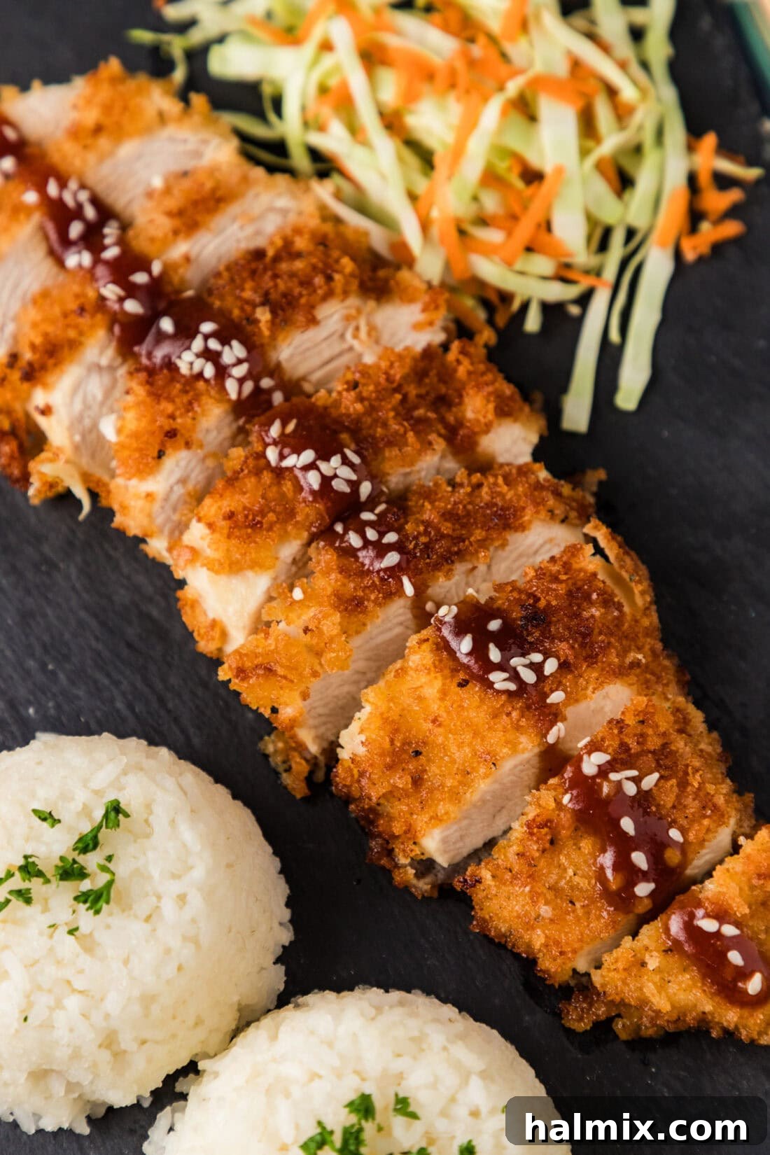Golden Crispy Chicken Delight 2 Close up photo of Chicken Katsu cut into slices on a platter, showcasing its golden, crispy exterior.