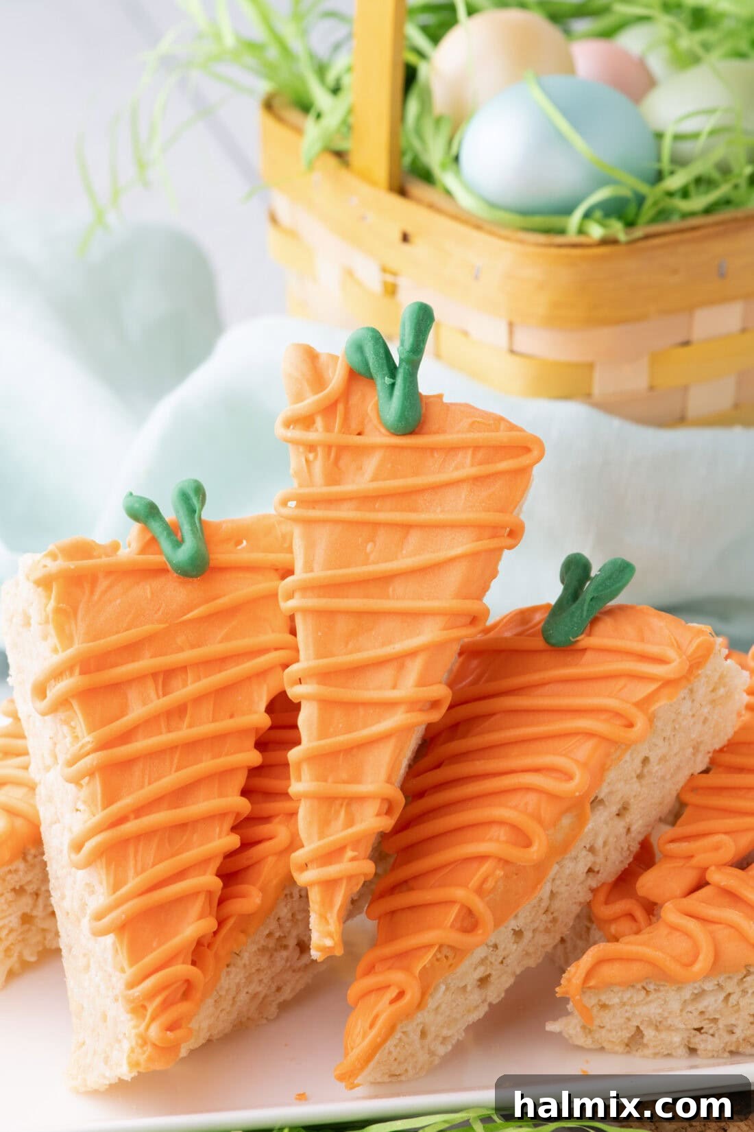 Carrot Cake Krispie Bites 2 Carrot Rice Krispy Treats stacked on a platter, ready for Easter festivities