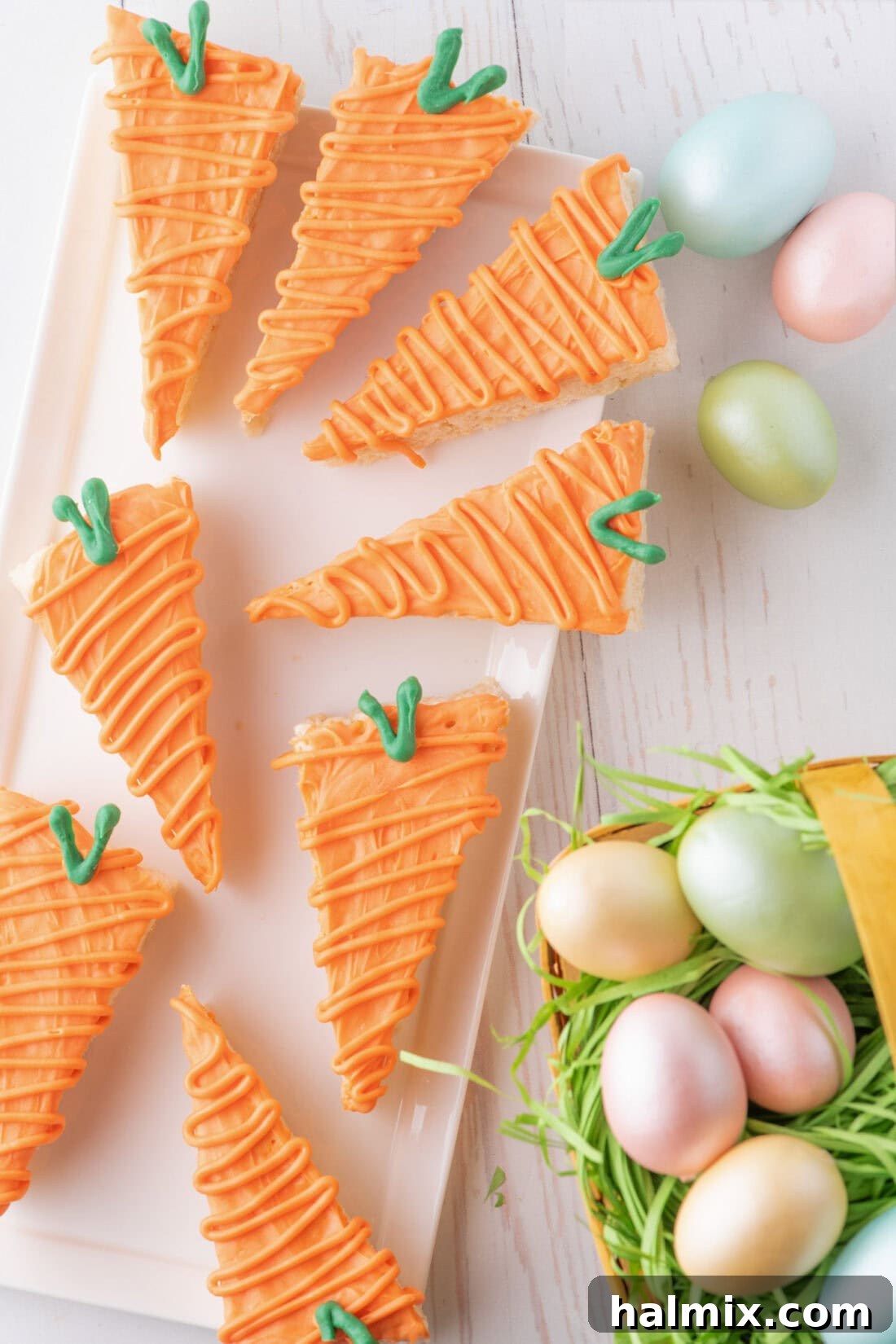 Carrot Cake Krispie Bites 10 Carrot Rice Krispy Treats arranged on a white platter with decorative Easter eggs