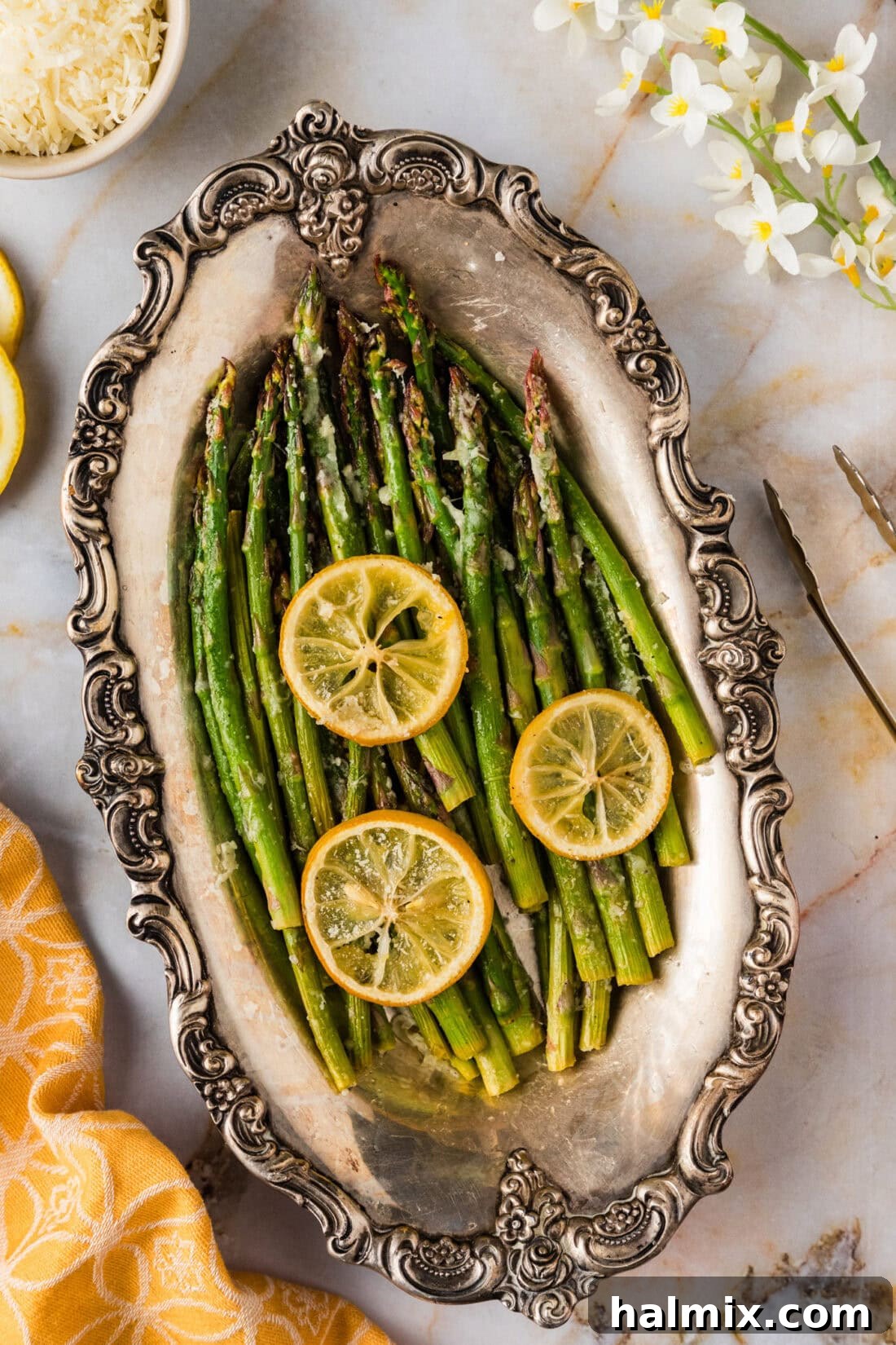 Bright Lemon Asparagus 3 Platter of vibrant green Lemon Asparagus with lemon wedges and a sprinkle of herbs