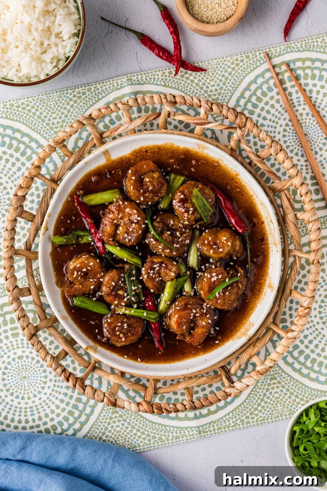 A beautifully plated dish of Mongolian Shrimp, garnished and ready to eat.