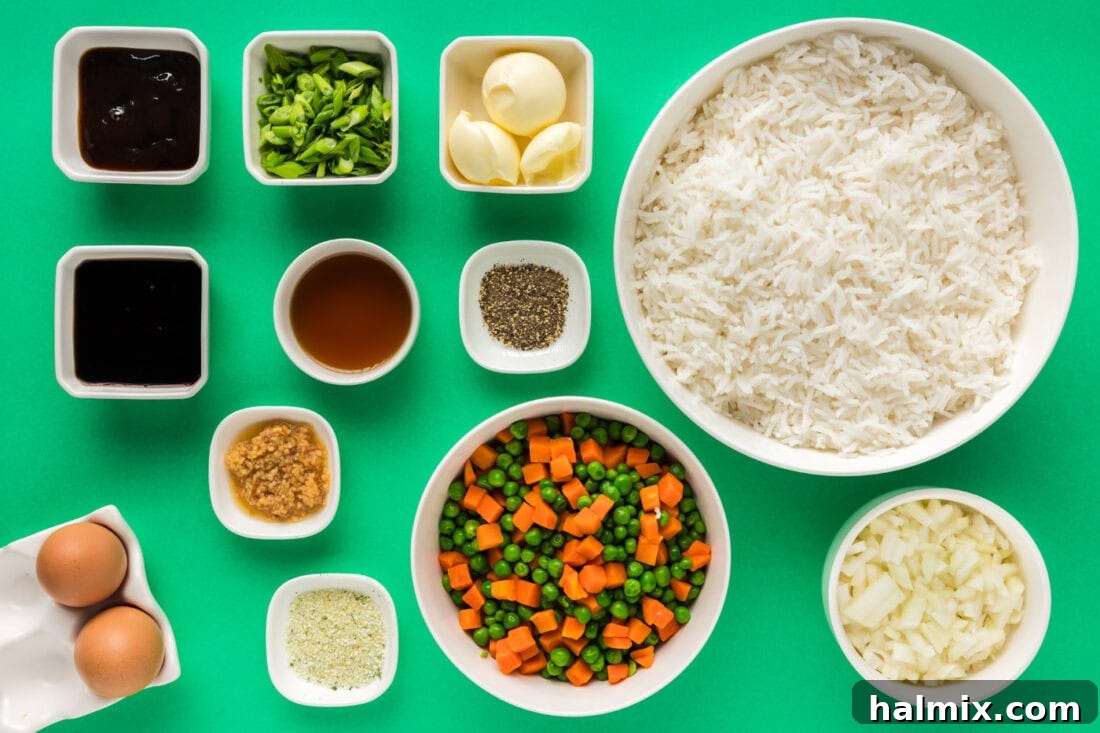 Ingredients for Fried Rice laid out on a cutting board, ready for preparation