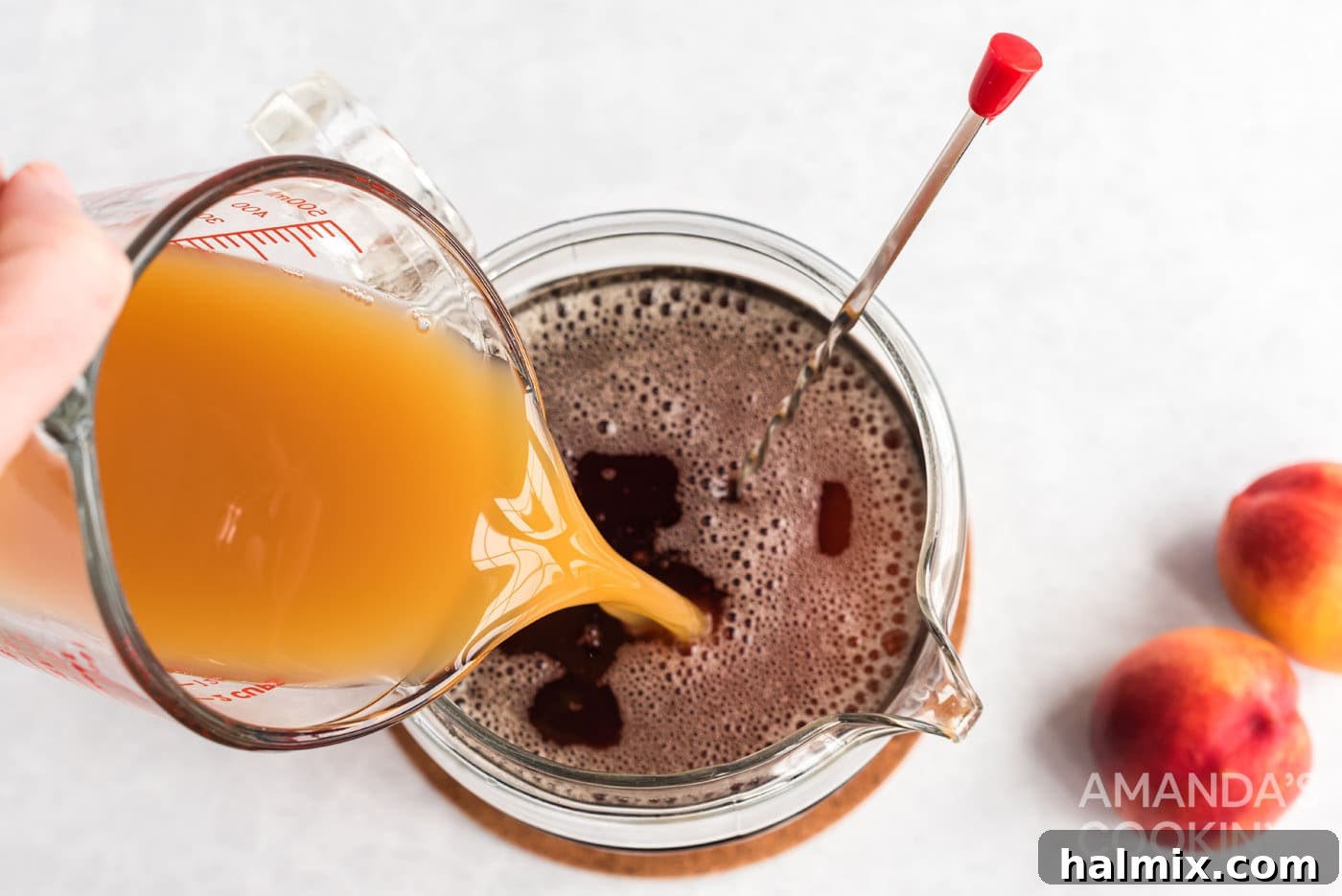Sun-Kissed Peach Tea 7 Pouring peach nectar into the sweetened tea.
