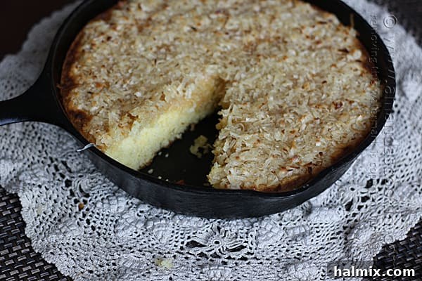 Easy Garden Cake 5 A close-up view of the golden, bubbly caramelized coconut topping on a Lazy Daisy Cake, highlighting its texture.