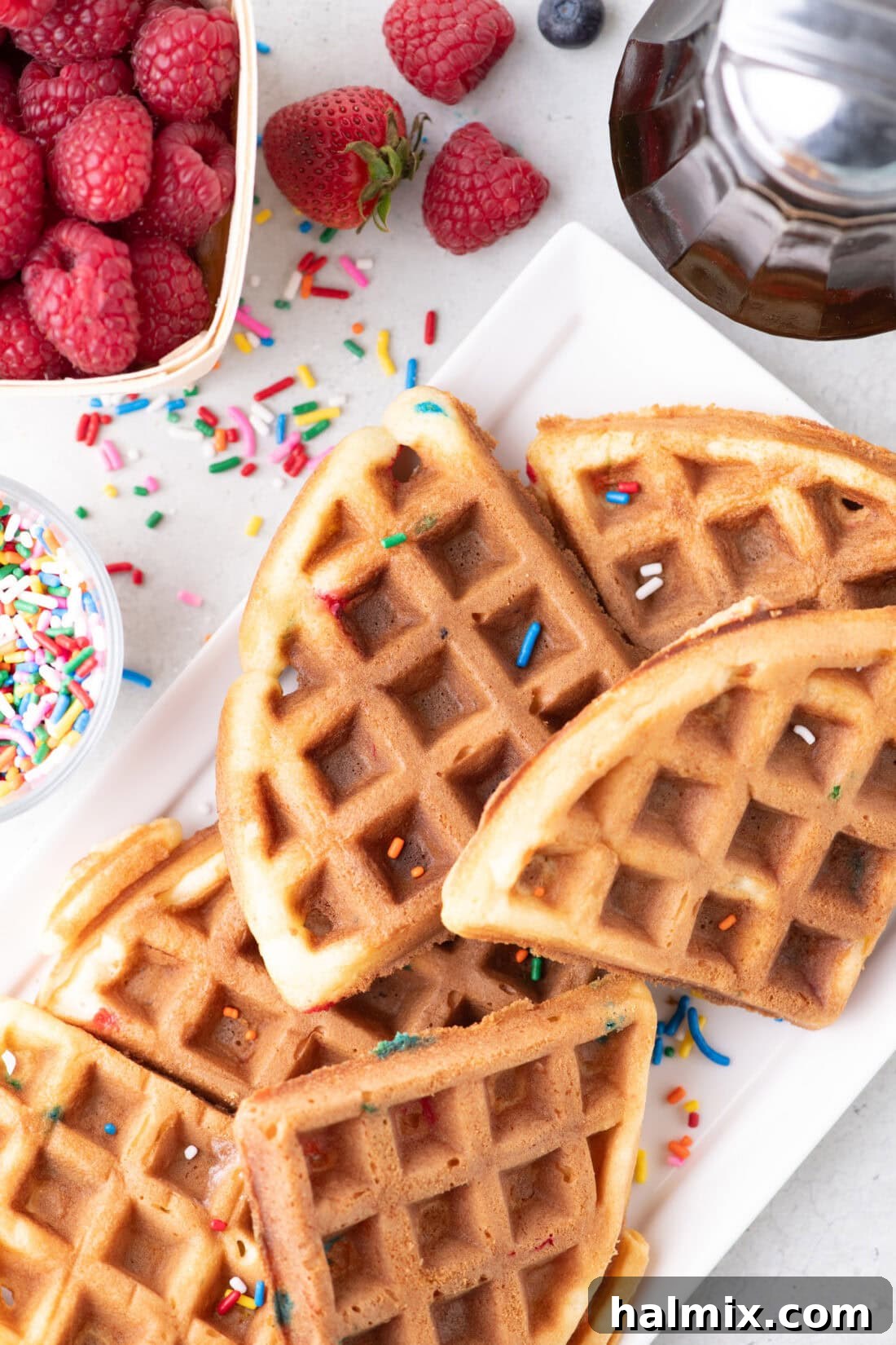 Cake Mix Waffles cut into triangles on a platter, ready to be served.