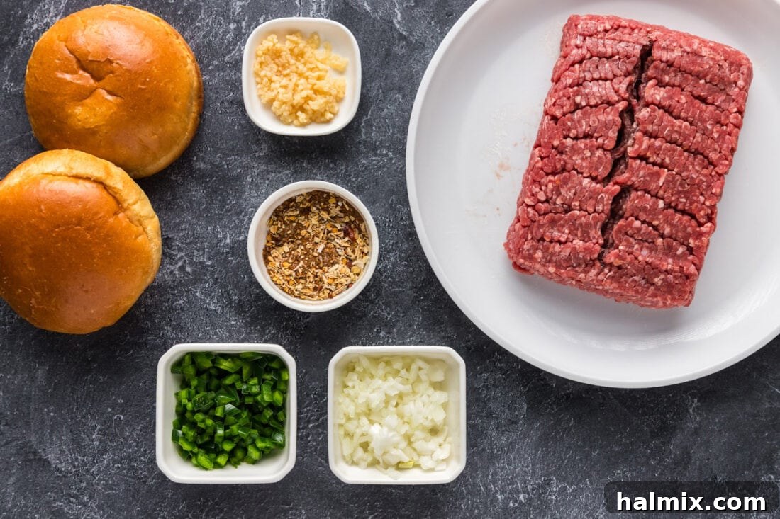 Fiesta Burger 4 A vibrant selection of fresh ingredients laid out for making Taco Burgers, including ground beef, taco seasoning, onions, jalapeños, garlic, and fresh vegetables.