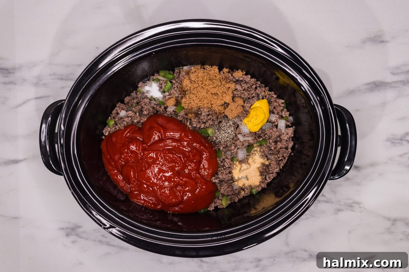 Ultimate Slow Cooker Sloppy Joes 6 Sloppy joe ingredients, including the sauce components, mixed together in a crockpot