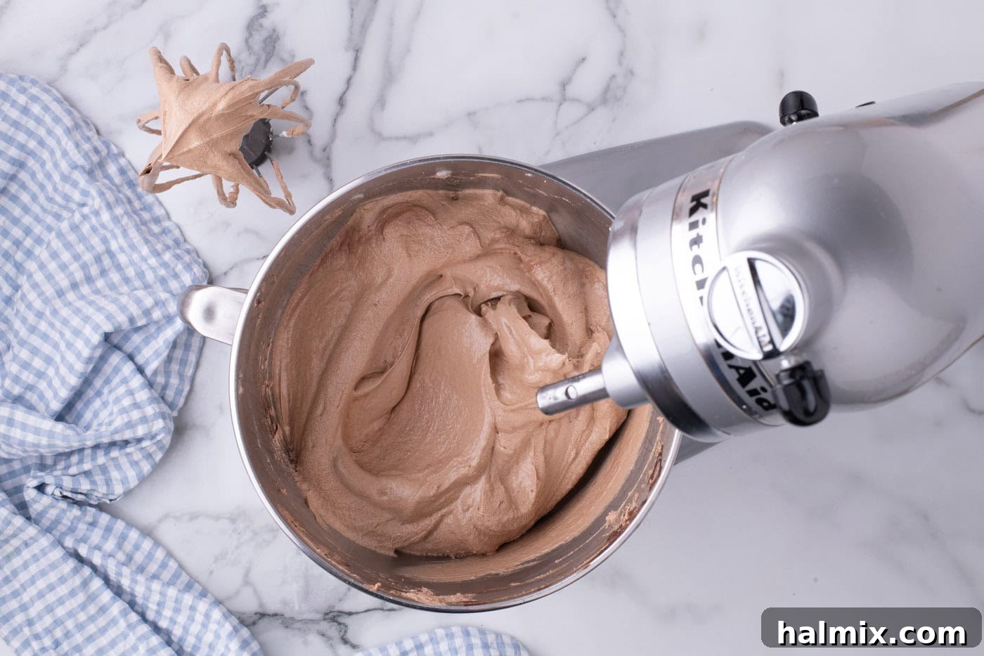 Smooth and voluminous French silk pie filling in a stand mixer bowl, ready for assembly.