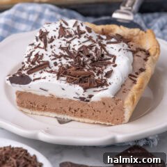 Slice of French Silk Slab Pie being placed on a plate