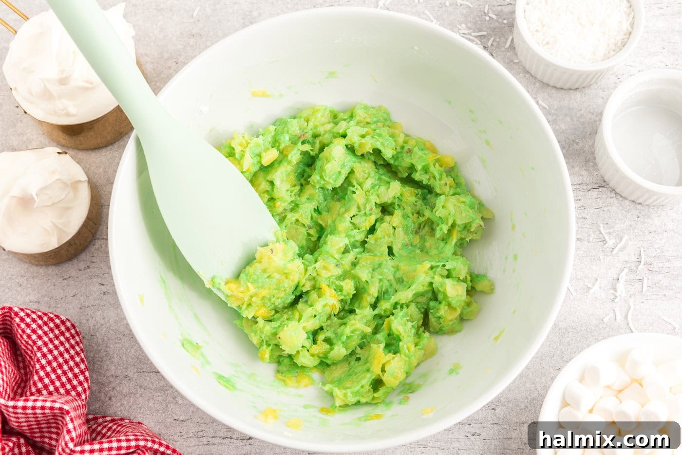 Emerald Cloud Dessert 5 pistachio pudding mixed with crushed pineapple in a bowl