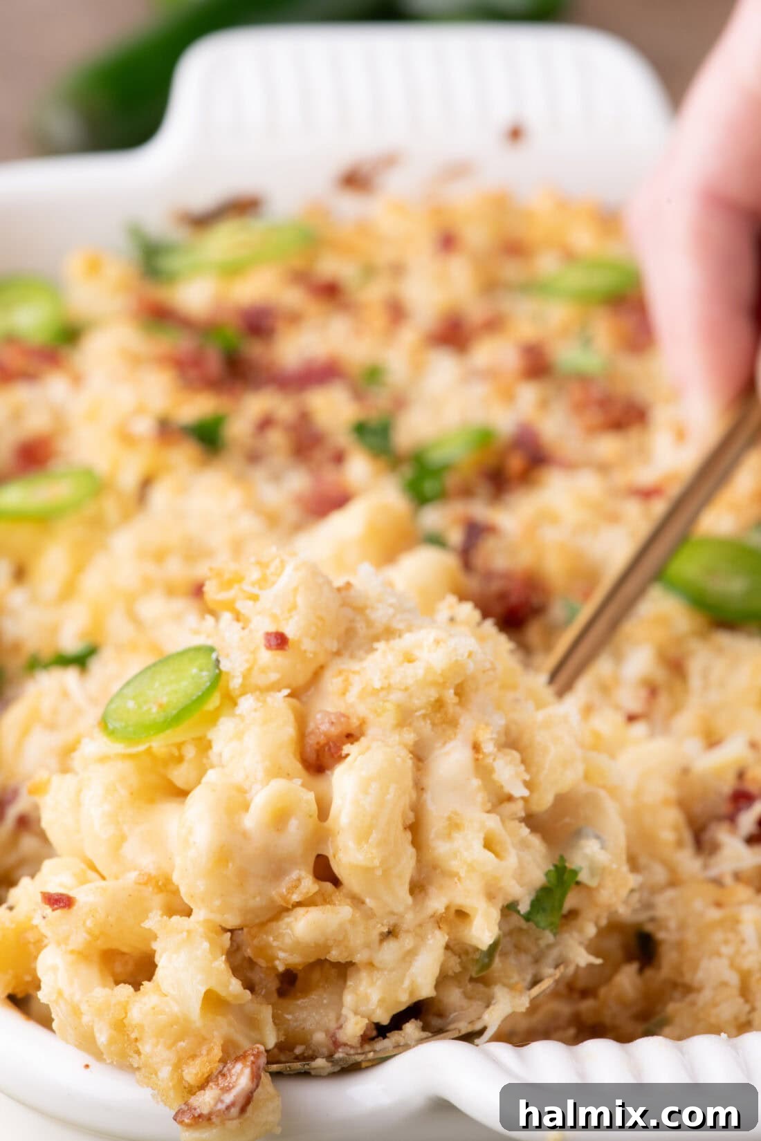 Kicking Cheesy Jalapeño Mac 3 Spoon lifting out a serving of Jalapeno Popper Mac and Cheese