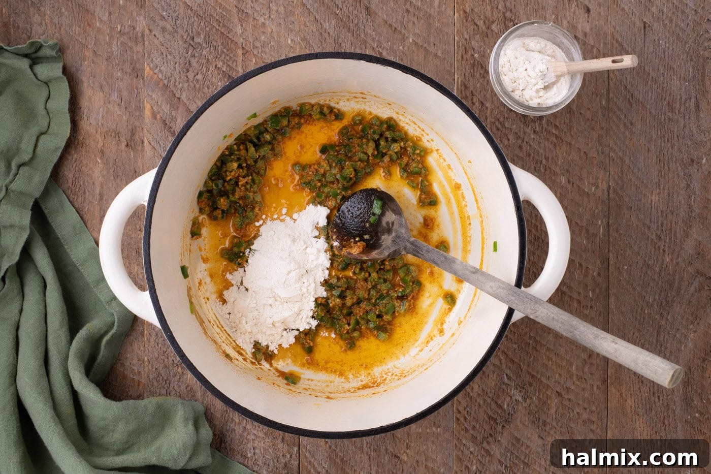 Kicking Cheesy Jalapeño Mac 5 adding spices to pot with jalapenos and butter