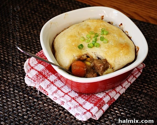 Rich Beef Stew Biscuit Pot Pie in a ramekin, a hearty homemade meal