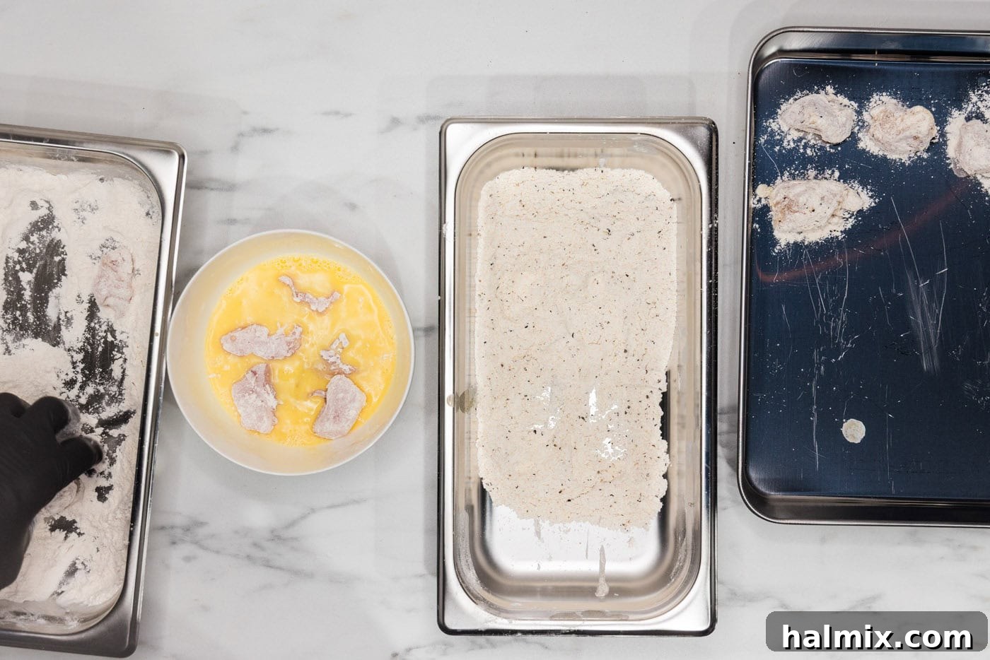 dredged chicken in a bowl of water and egg