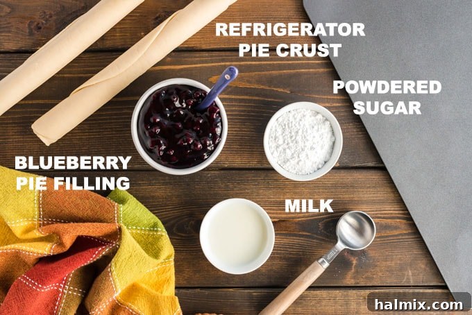 Sweet Blueberry Turnovers 2 A visually appealing diagram showcasing the four simple ingredients needed for blueberry hand pies: blueberry pie filling, pie crusts, powdered sugar, and milk.