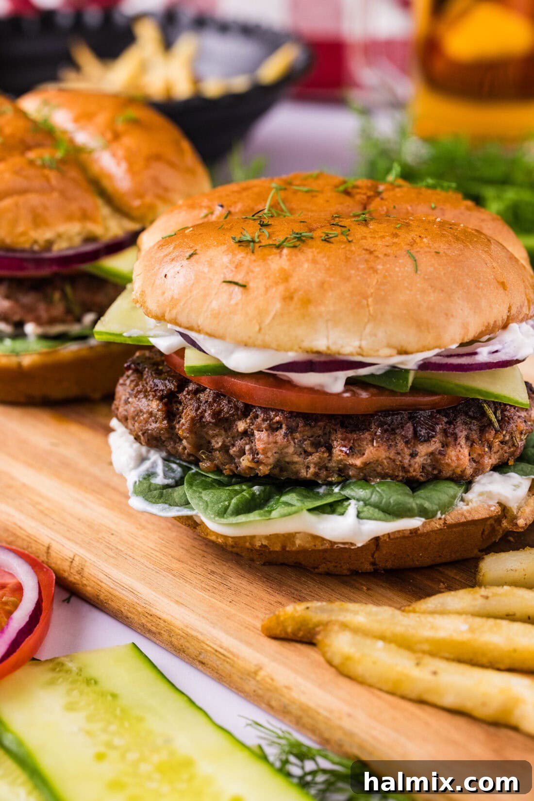Close up photo of a succulent lamb burger on a wooden board, ready for a bite