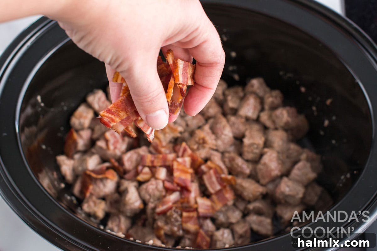 sprinkling bacon over beef