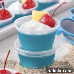 Close up photo of a stack of Blue Hawaiian Jello Shots