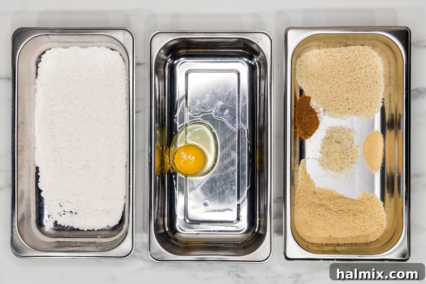 breading trays with flour mixture, egg, and panko mixture