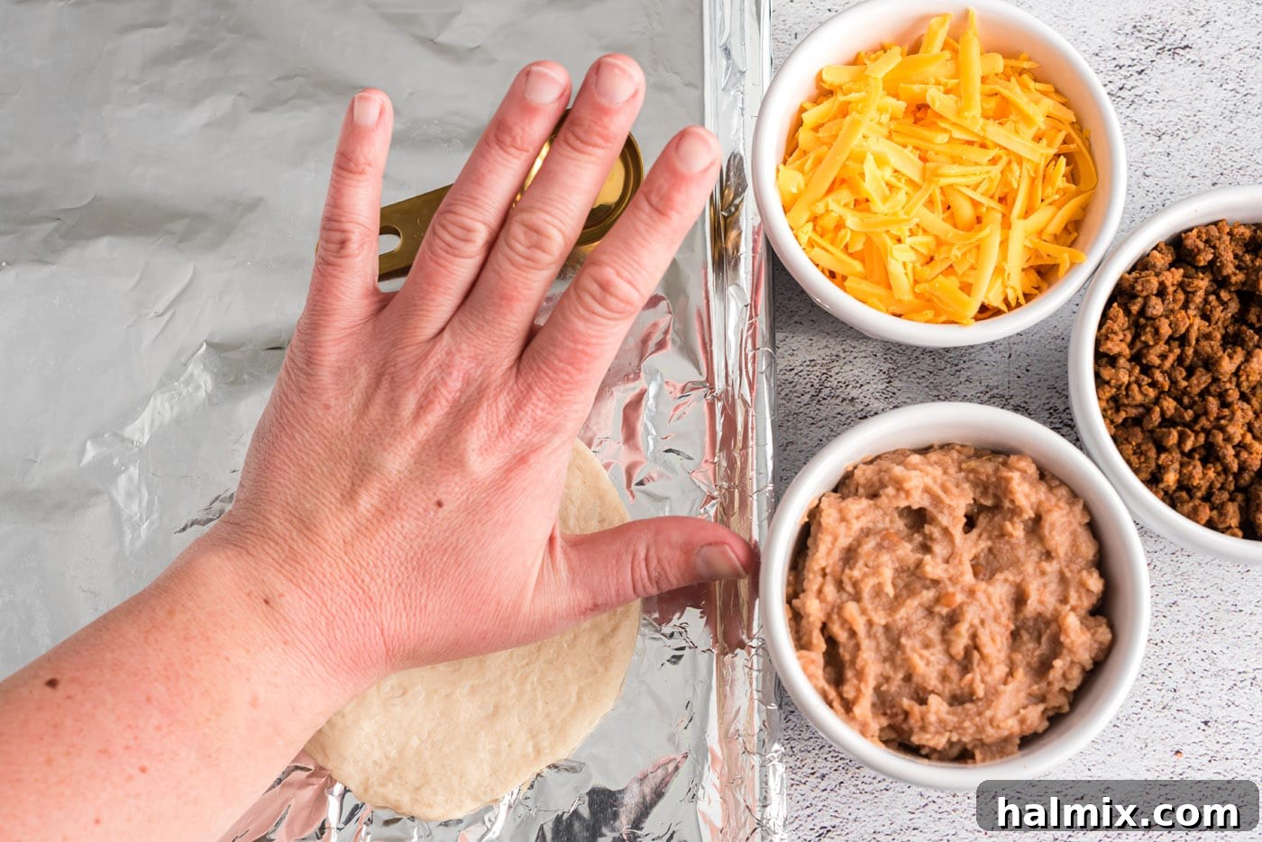 Fiesta Taco Pockets 5 flattening refrigerator dough on foil