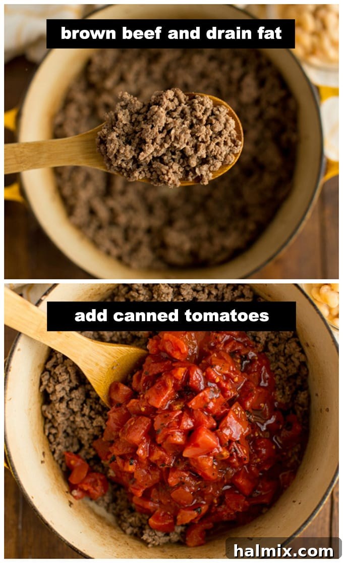 Close-up overhead view of ground beef browning in a large skillet or Dutch oven, showing the meat changing color as it cooks.