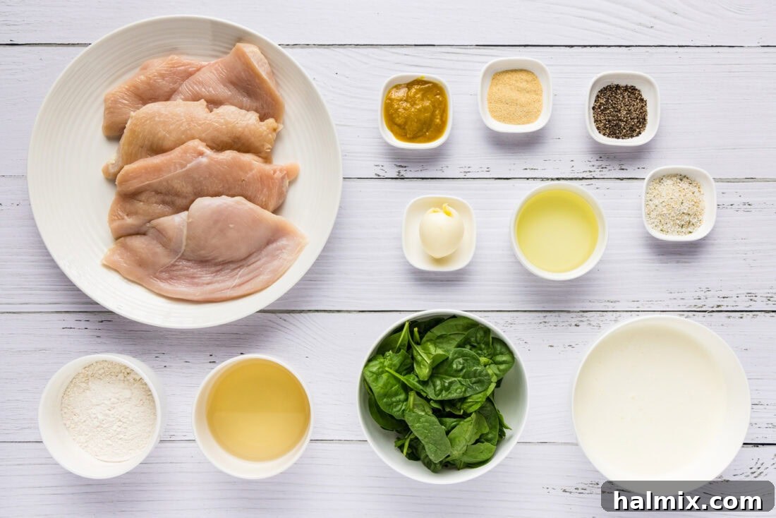 Array of fresh ingredients for Chicken Florentine, including chicken, spinach, cream, and spices