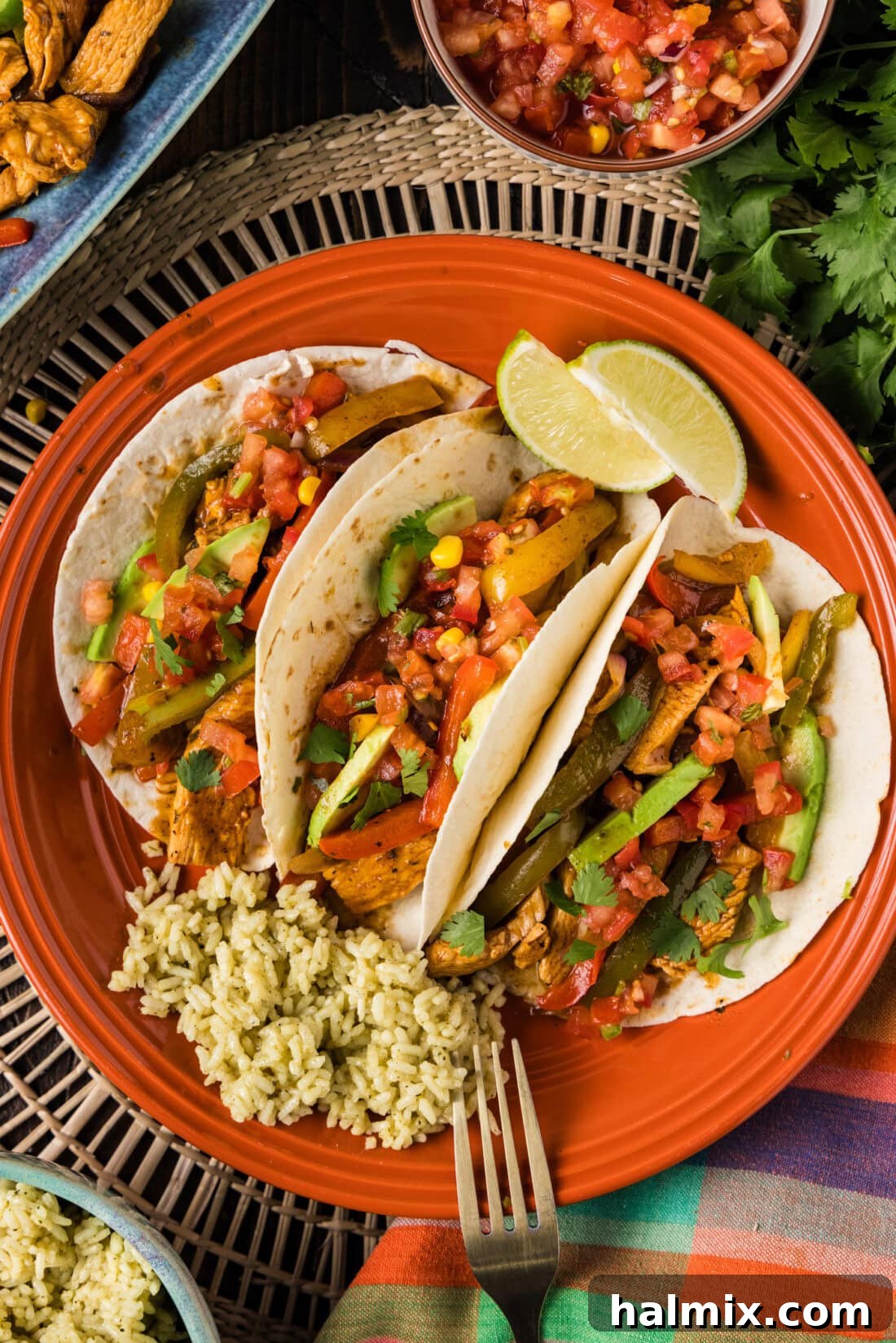 Sizzling Chicken Fajitas 3 Chicken Fajitas wrapped in warm tortillas on a plate, ready to eat