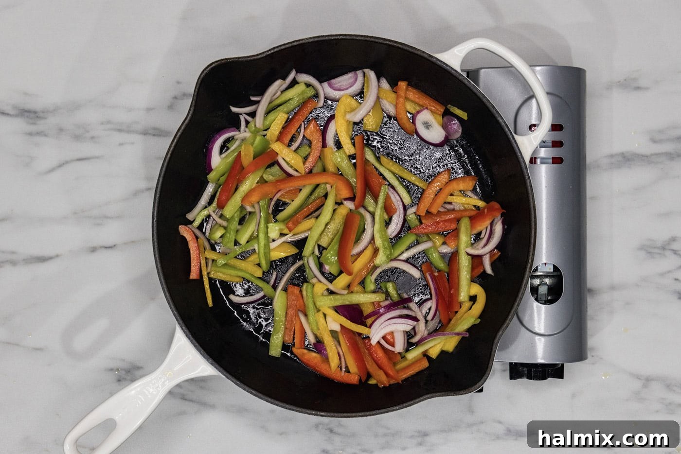 Sizzling Chicken Fajitas 5 Sautéing bell peppers and onions in a skillet