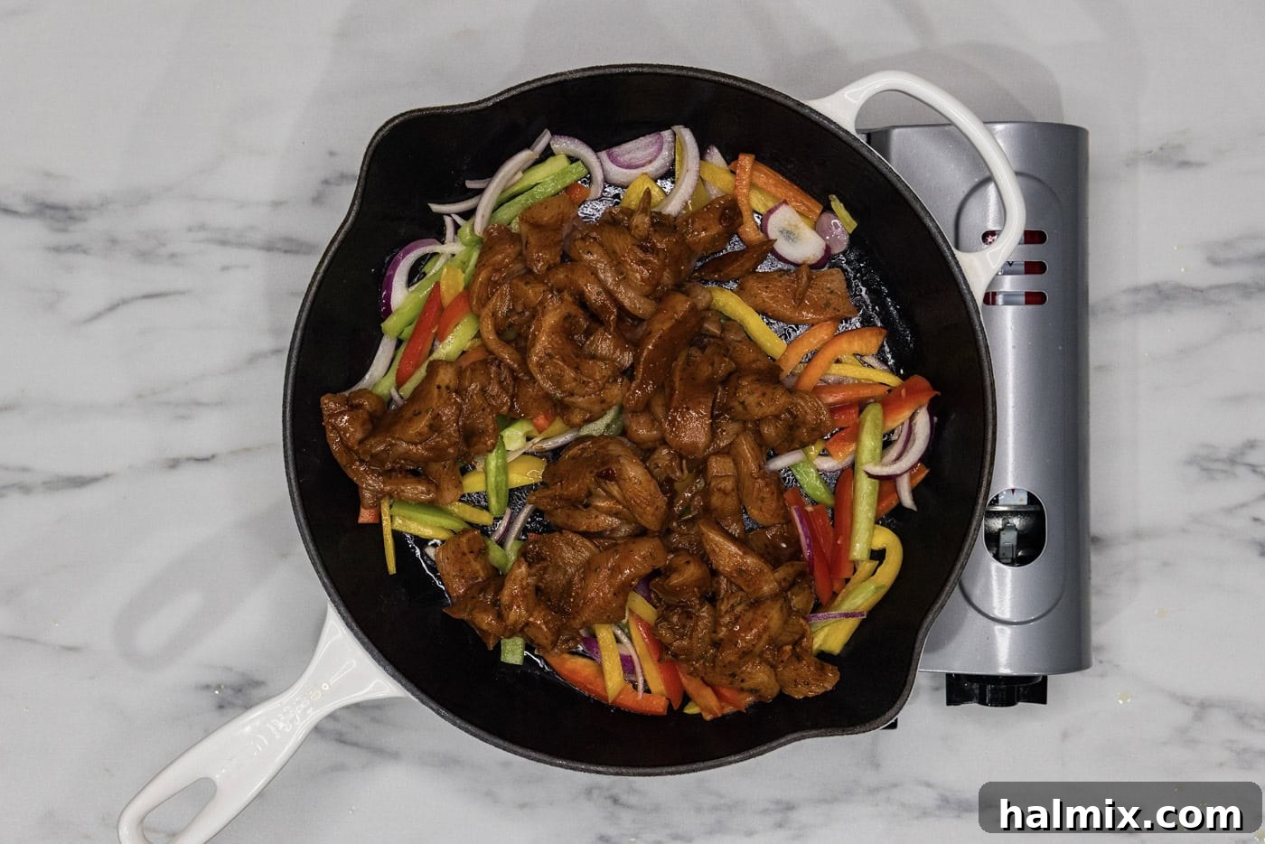 Sizzling Chicken Fajitas 6 Marinated fajita chicken added to skillet with bell peppers and onions