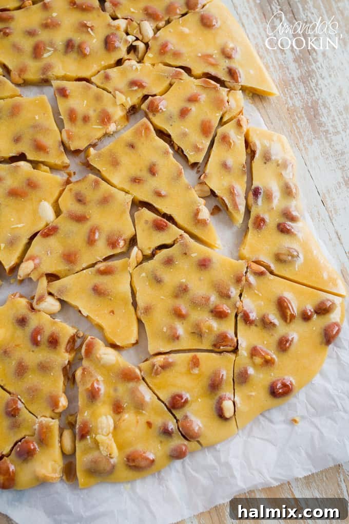 Golden homemade peanut brittle broken into perfect, inviting pieces
