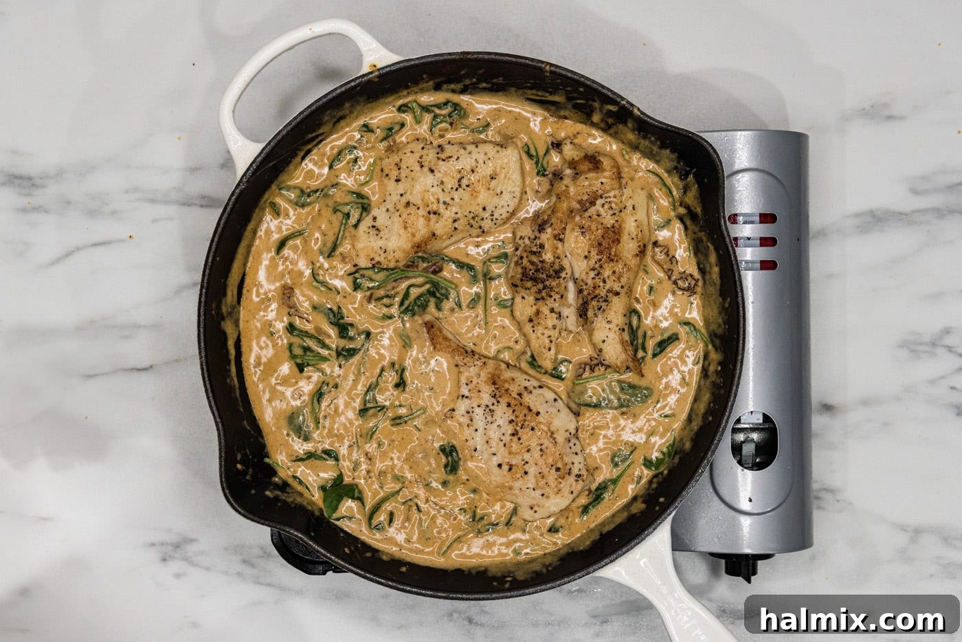 Creamy Sun-Dried Tomato Tuscan Chicken 11 chicken breasts in a skillet with tuscan sauce