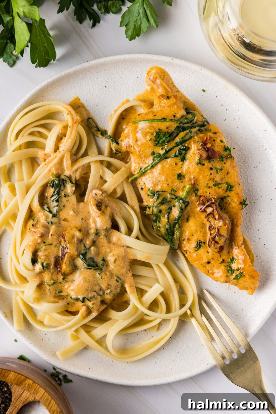 Creamy Sun-Dried Tomato Tuscan Chicken 12 Tuscan Chicken on a plate with noodles