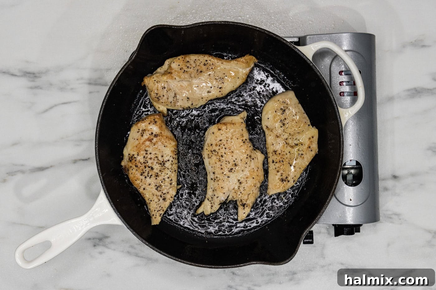Creamy Sun-Dried Tomato Tuscan Chicken 5 cooked chicken breasts seared in a skillet